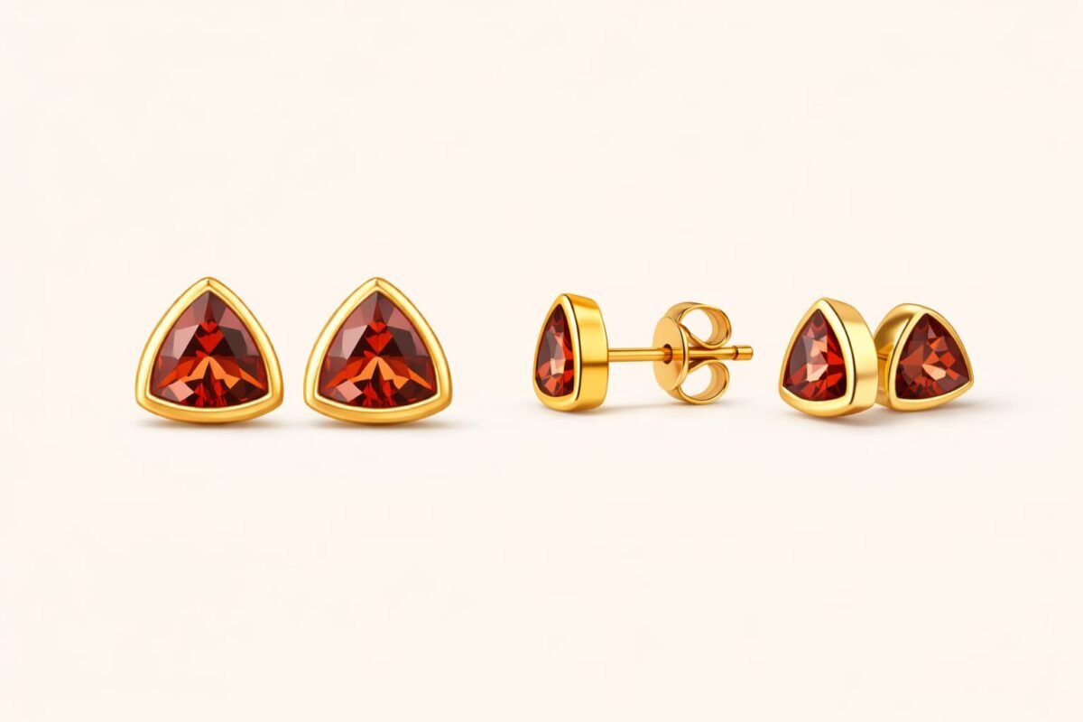 Plated sterling silver earrings with fiery red triangular gemstones.