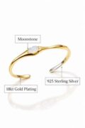 Minimalist gold-plated sterling silver cuff with moonstone accent.