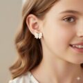 Delicate white bow earrings for kids, minimal and elegant design.