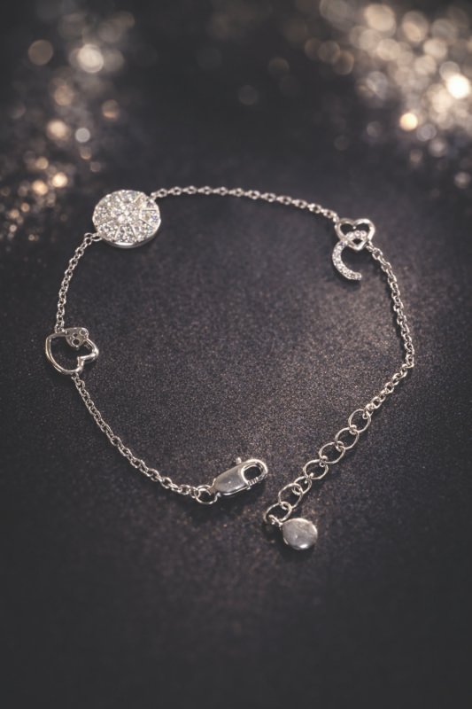 Minimalist sterling silver bracelet with moon and heart charms for women and teens.