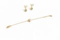 Gold heart earrings and bracelet with bow details for women and teens.