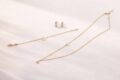 Gold and silver jewelry set with star and round pendant, earrings included.