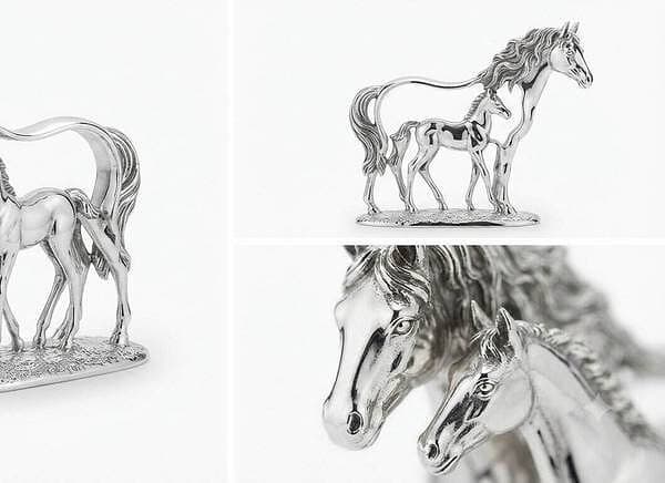 Detailed silver horse sculpture with foal, perfect for jewelry display or decor.