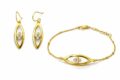 Gold and silver jewelry set with floral design for women.