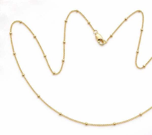 Delicate gold plated silver necklace with small bead accents for women and teens.