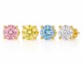 Set of four gemstone stud earrings in pink, yellow, blue, and clear with gold settings.