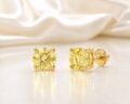 Elegant yellow gemstone stud earrings with gold backing.