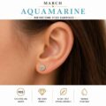 Close-up of a woman's ear wearing aquamarine birthstone stud earring.