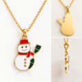Gold-tone snowman pendant on chain with red scarf and hat.