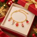 Gold-tone bracelet with five holiday charms in a gift box.