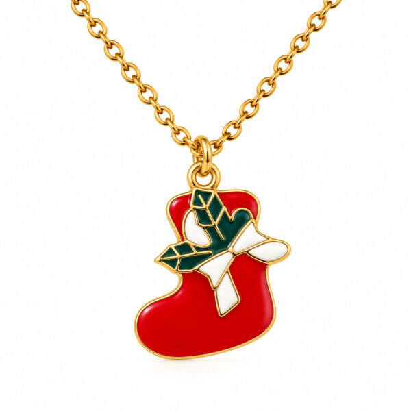 Red stocking pendant on gold chain with green bow in enamel.