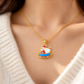 Gold necklace with Santa on sleigh pendant for women and teens.