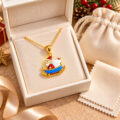Gold-plated silver necklace with Santa in sleigh pendant in gift box.