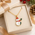 Gold-tone snowman pendant necklace in gift box.
