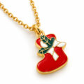 Gold Santa Hat pendant necklace with green and white enamel ribbon.