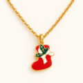 Gold-tone chain with red stocking pendant and bow.