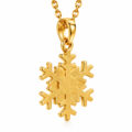 Gold snowflake pendant on a delicate chain for women and teens.