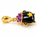 Gold and black enamel cat pendant with purple accents and star detail.