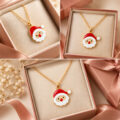 Gold-tone Santa Claus pendant in a gift box.